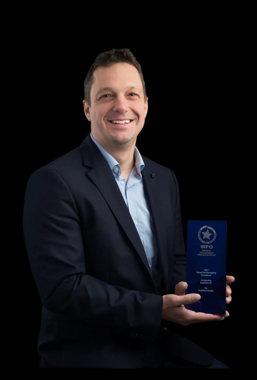 Gregor Brajovic holding a World Packaging Organisation award