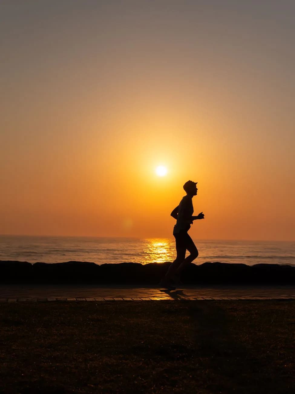 A person moving forward at sunset